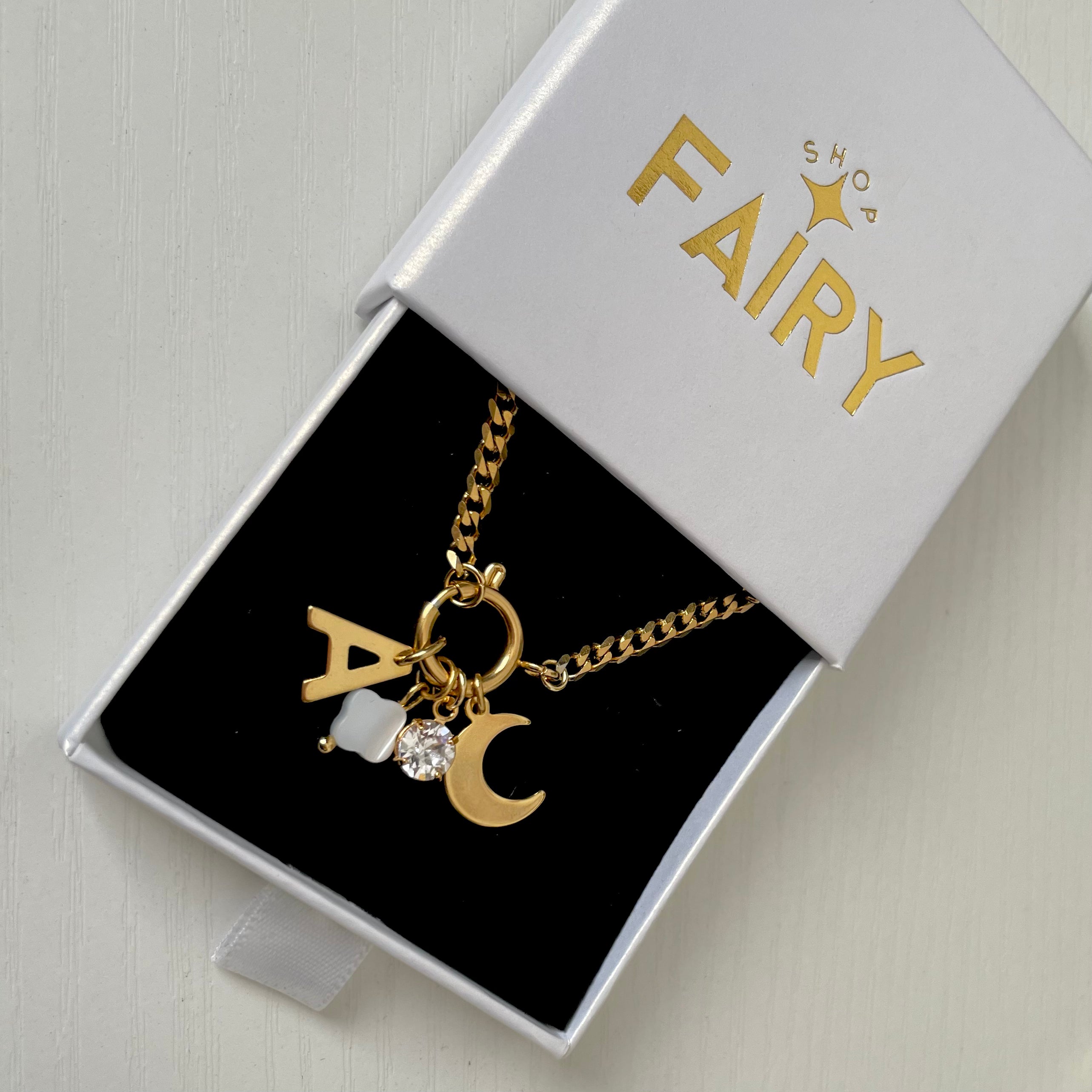 Crescent Moon Charm on a gold charm necklace uk