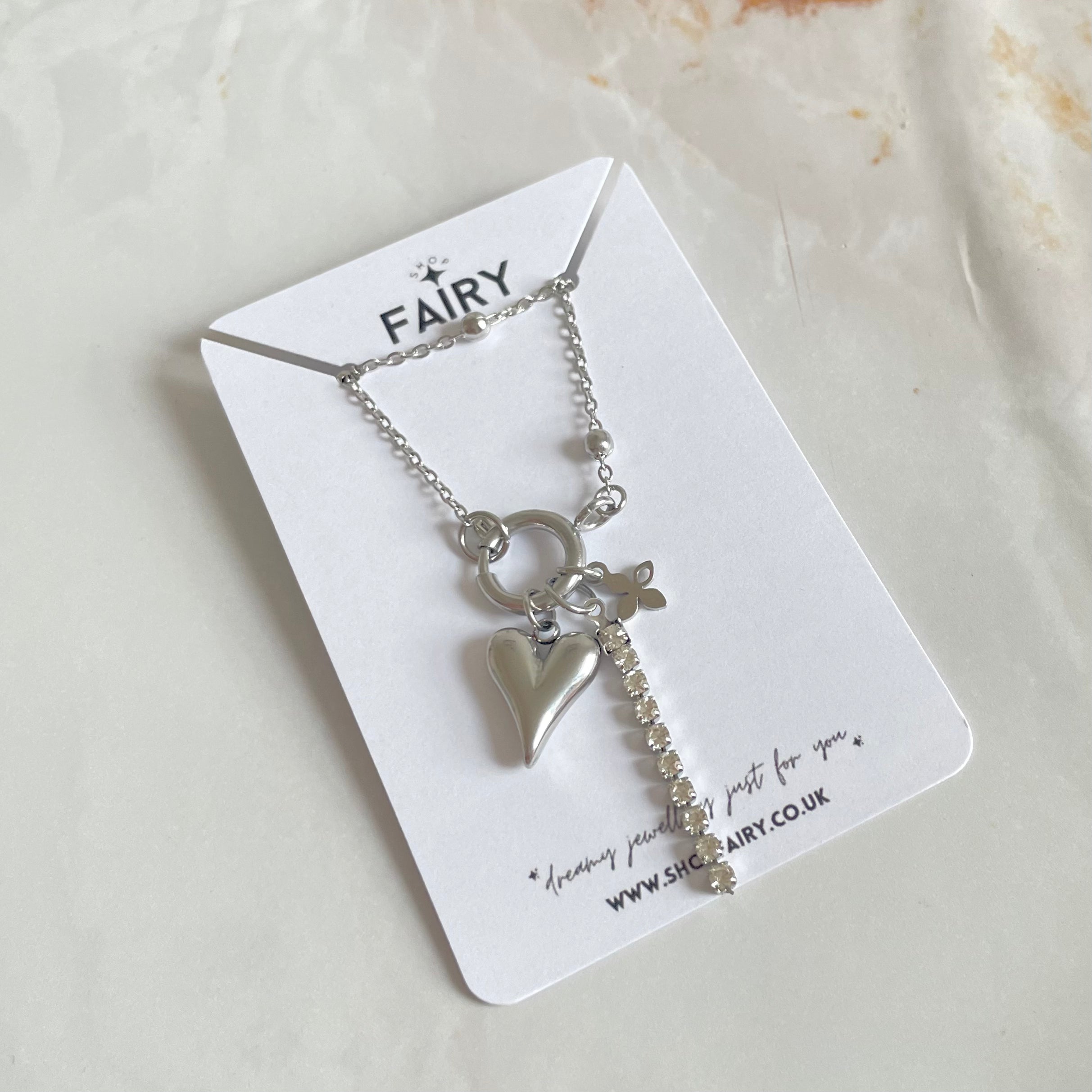 Silver charm necklace with heart charm