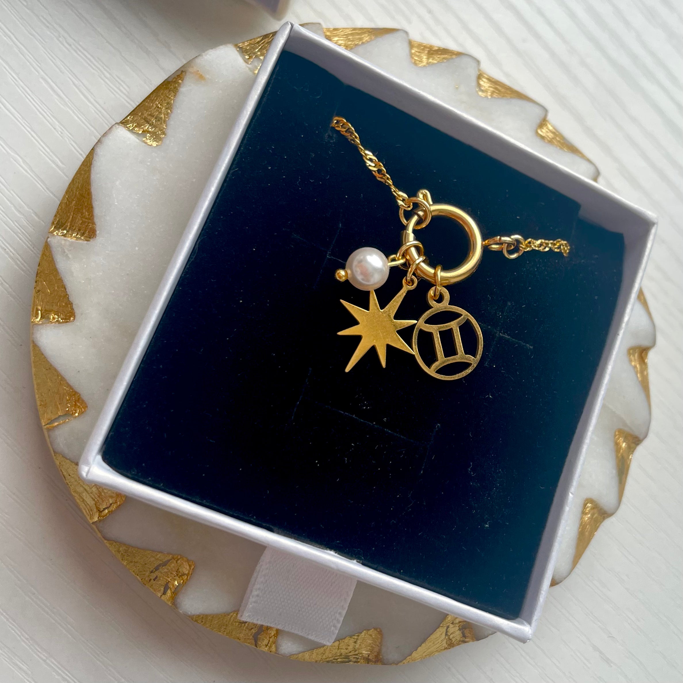 Single Pearl Charm on a gold charm necklace