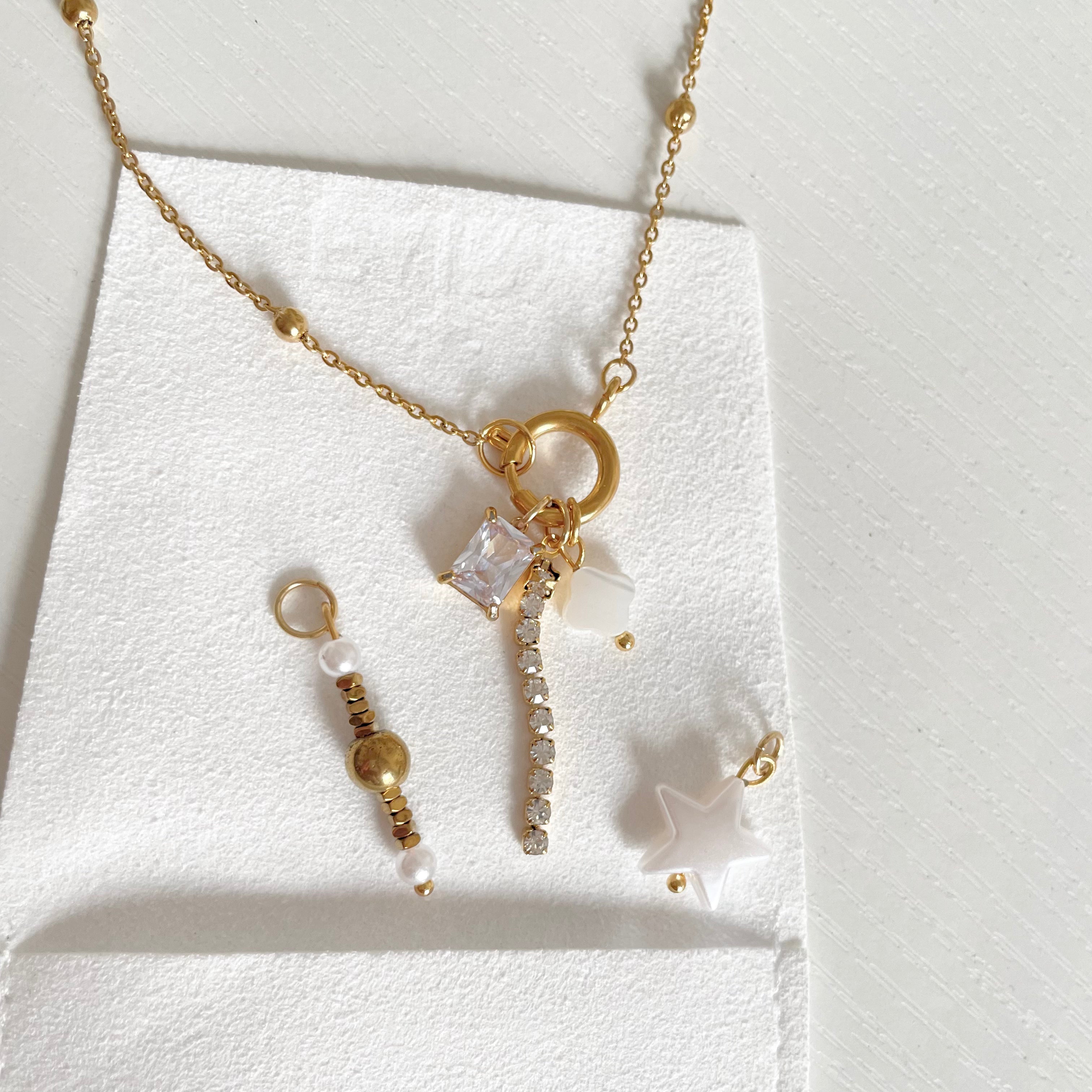 Star Bead Pearl Charm with a gold charm necklace