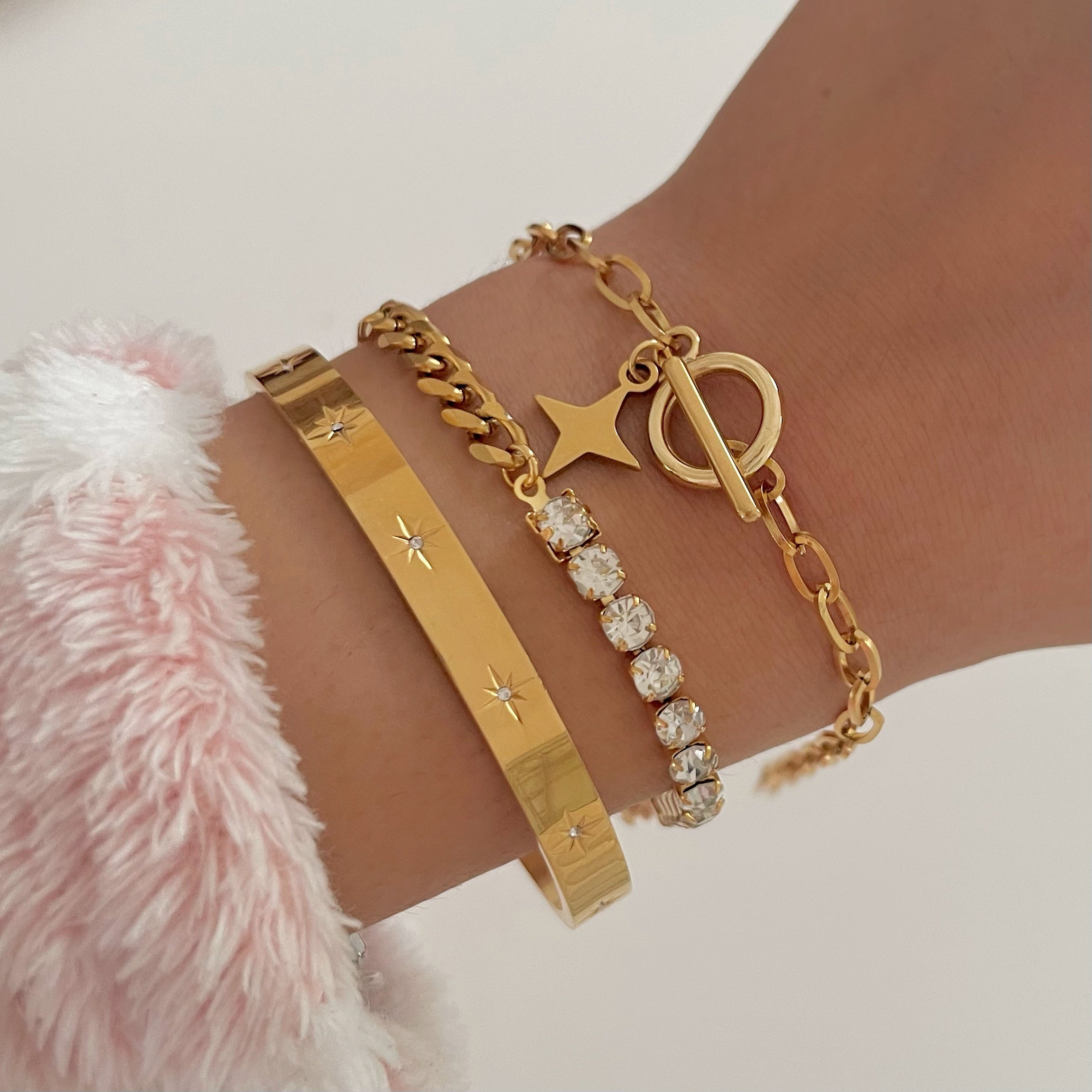 Tennis bracelet with gold cuff bracelet