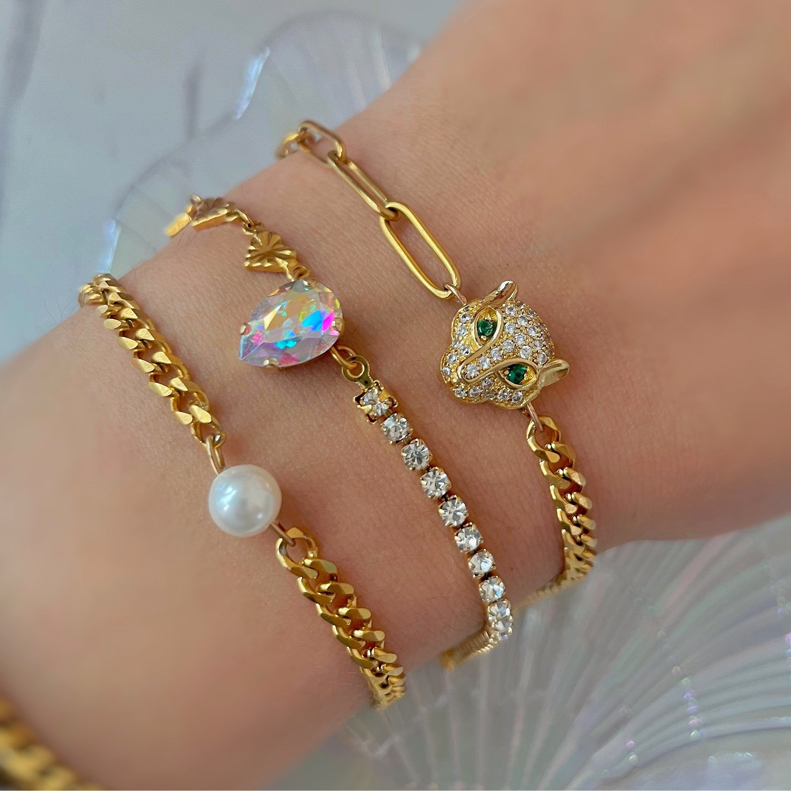 gold crystal bracelet stack with tennis chain and pear chain