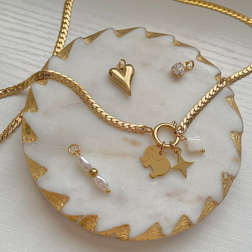 Baby Elephant Charm on a gold charm necklace uk