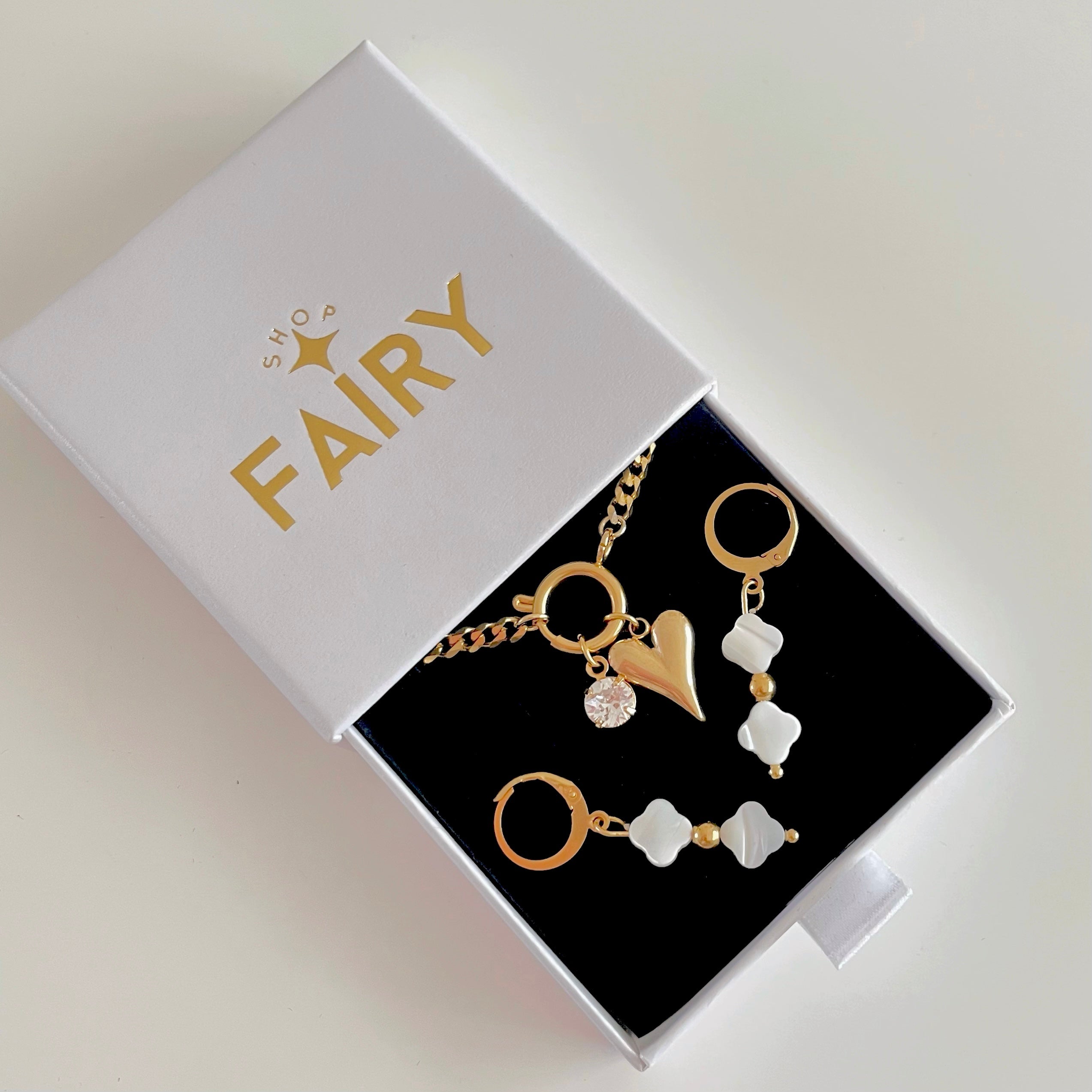Charm Necklace with heart charm and gold clover pearl earrings