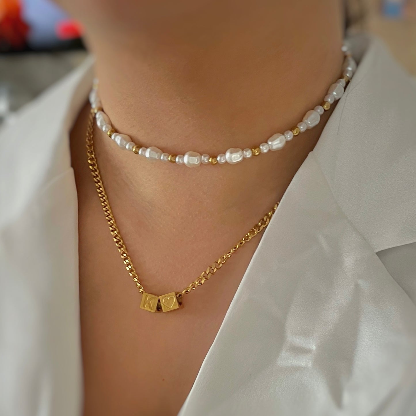 cube initial necklace with gold and and pearl necklace