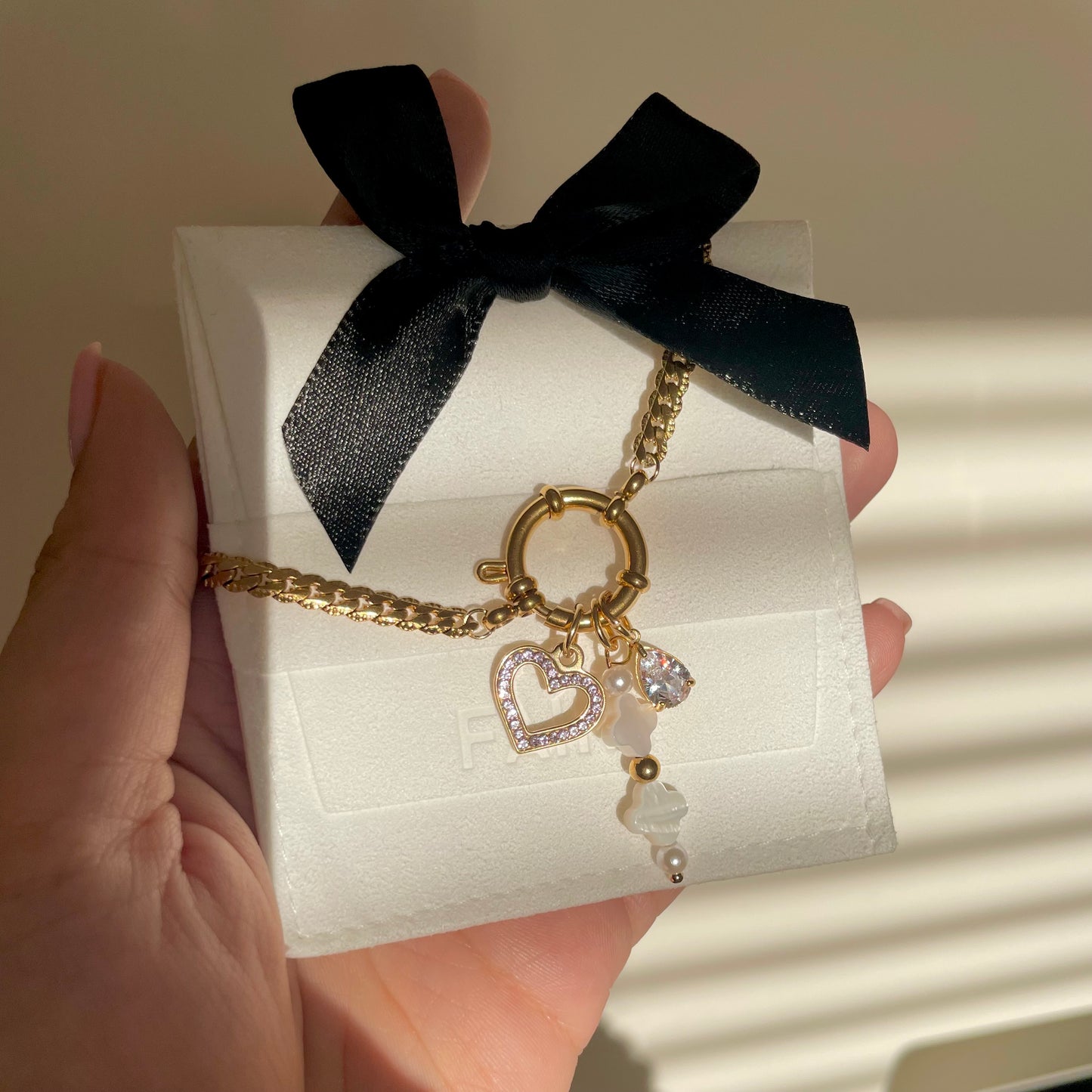 Gold Crystal Heart Charm on a Gold Charm Necklace with a clasp