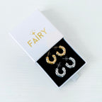 jewellery box featuring two pairs of hoops earrings - one pair gold with crystals and the other pair silver with crystals 
