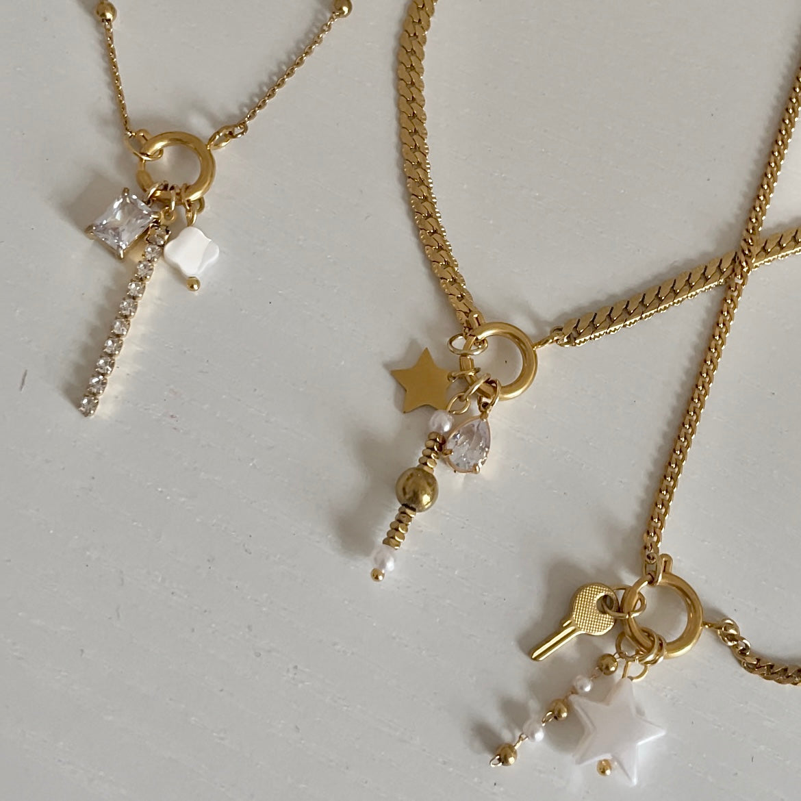 Gold charm necklaces with gold charms