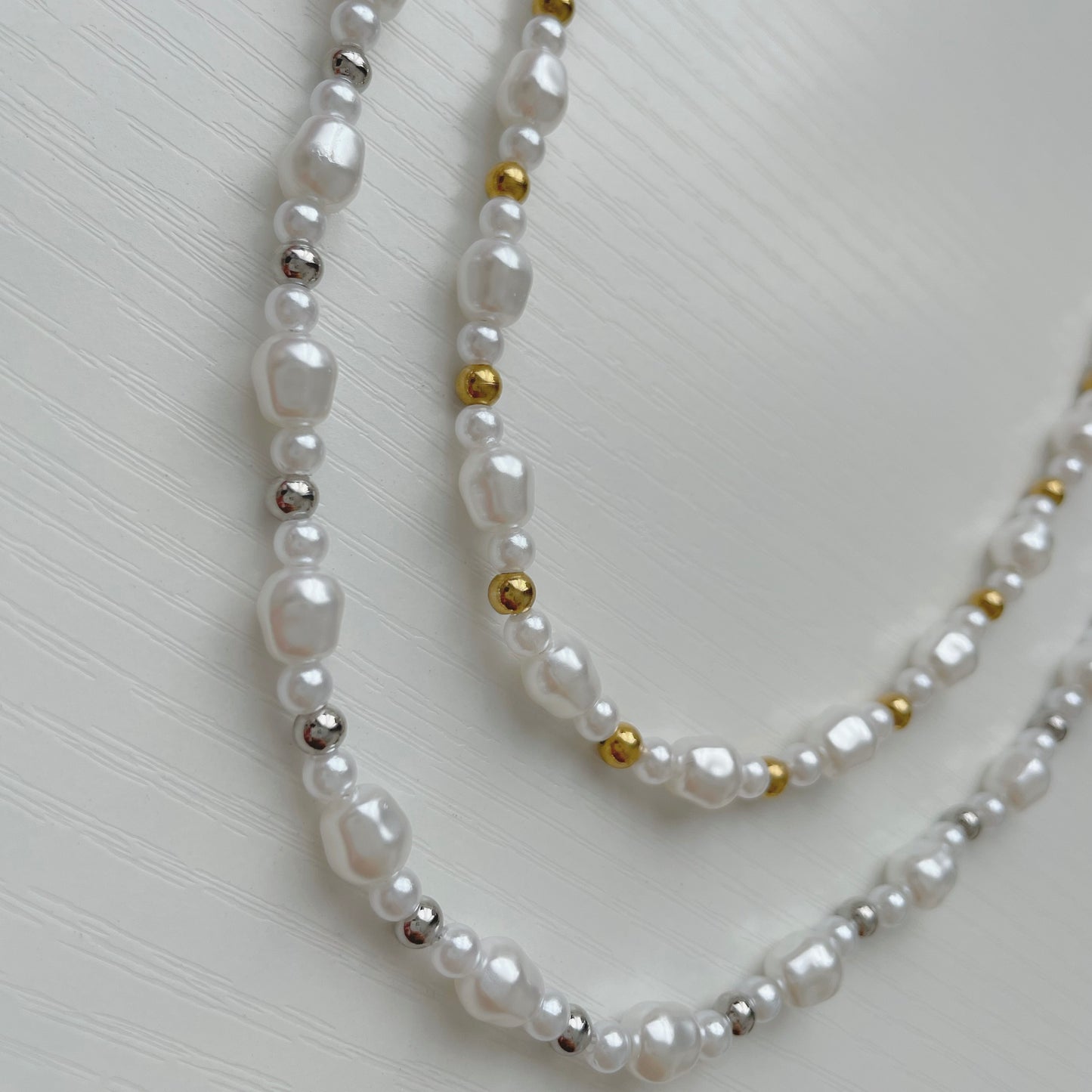 pearl necklace with a mixture of gold and silver beads