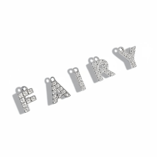 Silver letter charms spelling 'FAIRY' on a white background