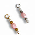 Two pink beaded pearl charms with silver and gold beads, designed for attachment to jewelry like necklaces or bracelets.