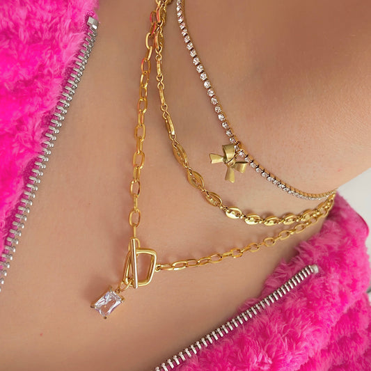 Ribbon Tennis Necklace with a gold necklace stack