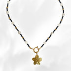 gold summer neckace with flower charm