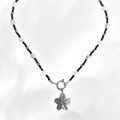 Necklace with a interchangeable slower charm  pendant on a white background