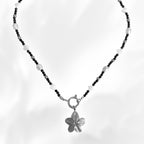Necklace with a interchangeable slower charm  pendant on a white background