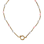 Necklace with pink and white beads on a white background