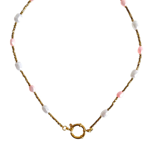 Necklace with pink and white beads on a white background