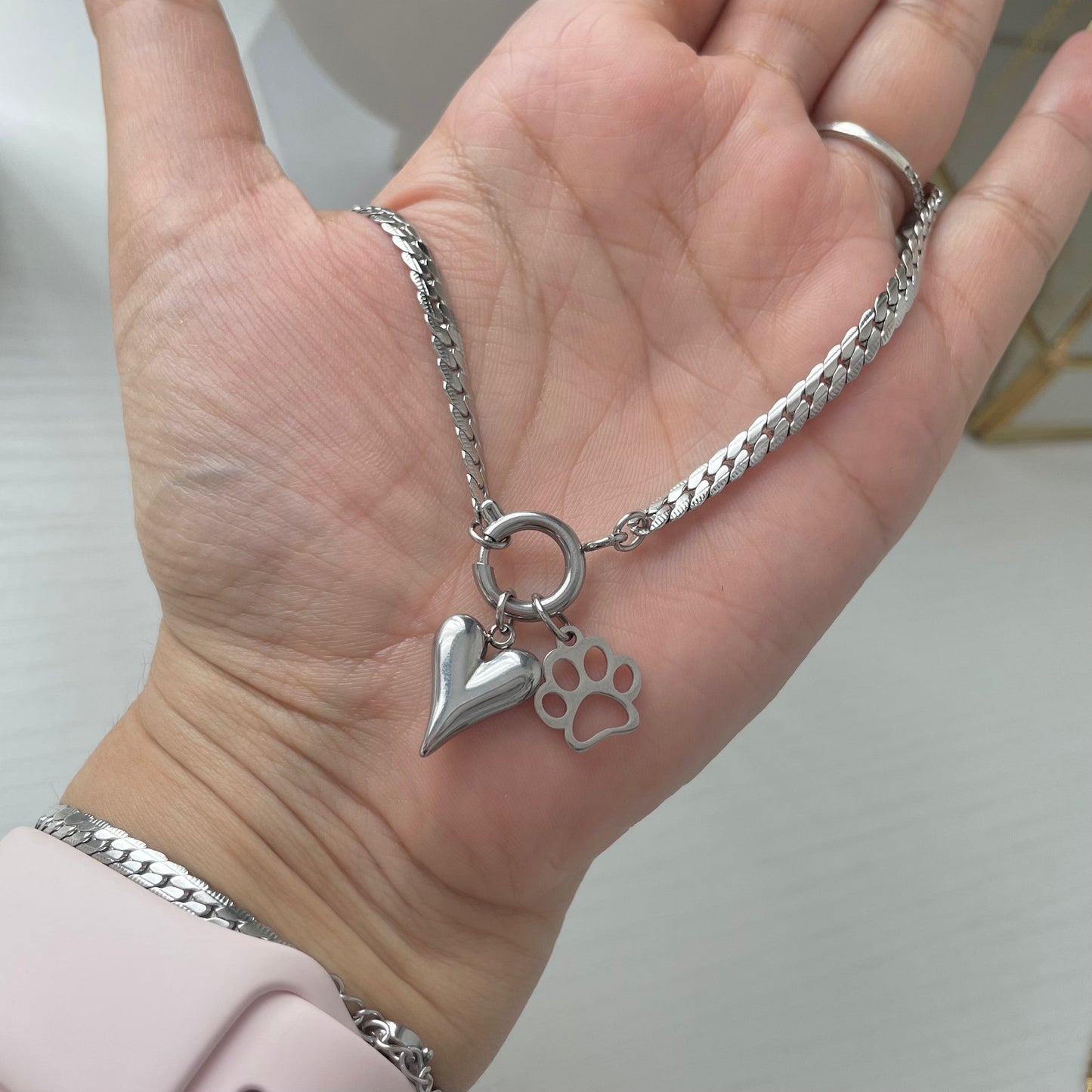 charm necklace with paw charm and heart charm