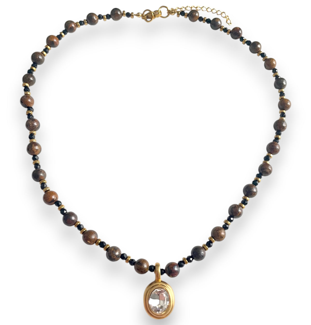brown and gold beaded necklace
with gold oval bezel charm