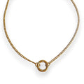 Gold necklace with a circular pendant on a white background