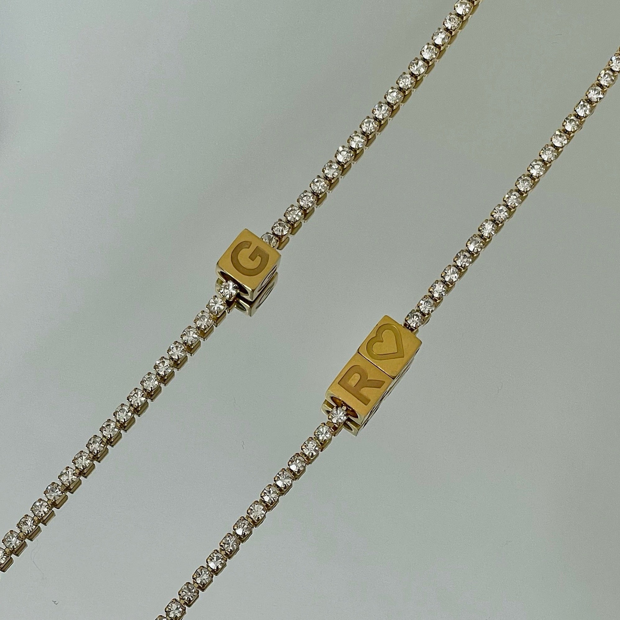 crystal cube initial necklace on a tennis chain