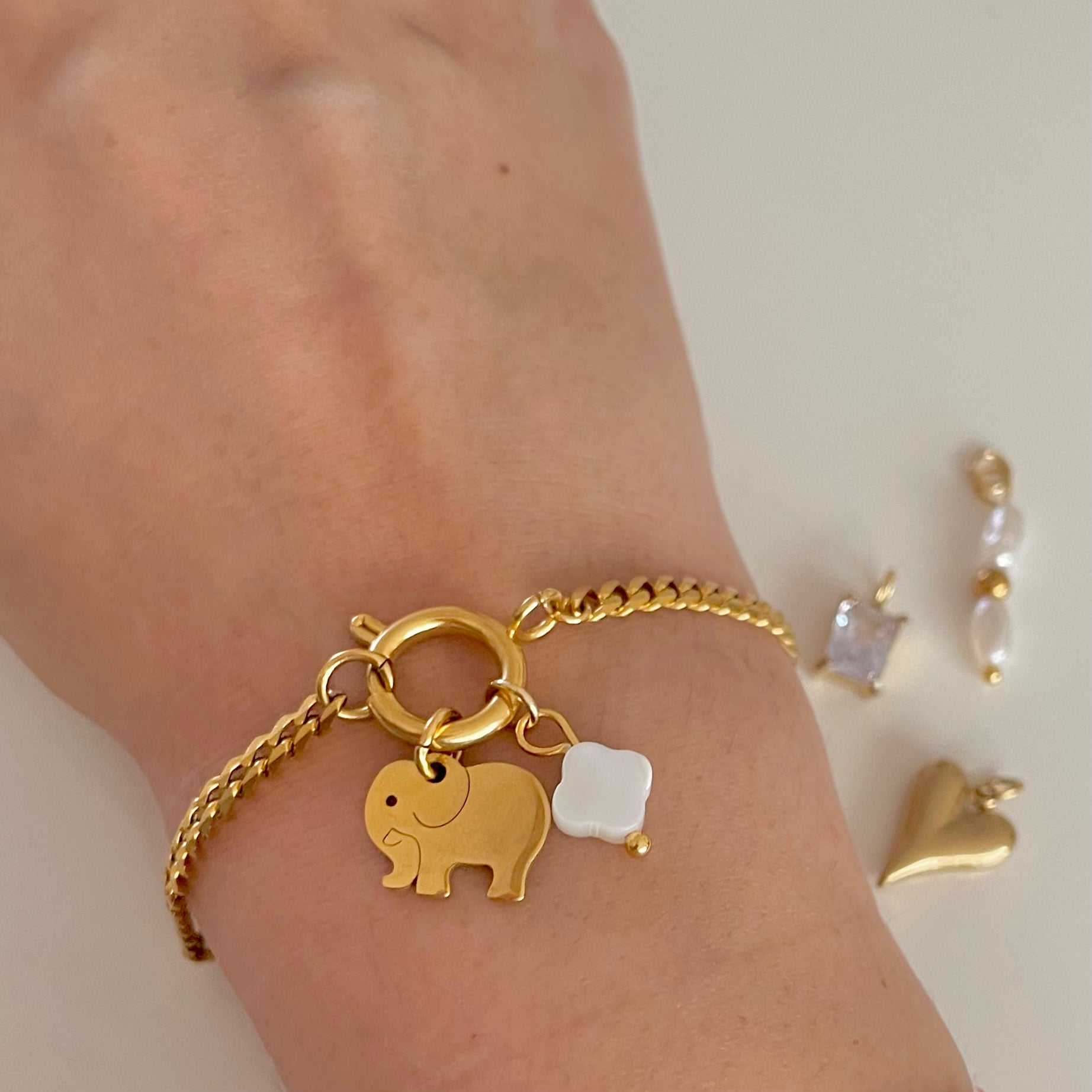 elephant charm on gold charm bracelet