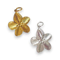 Gold and silver floral pendants on a white background