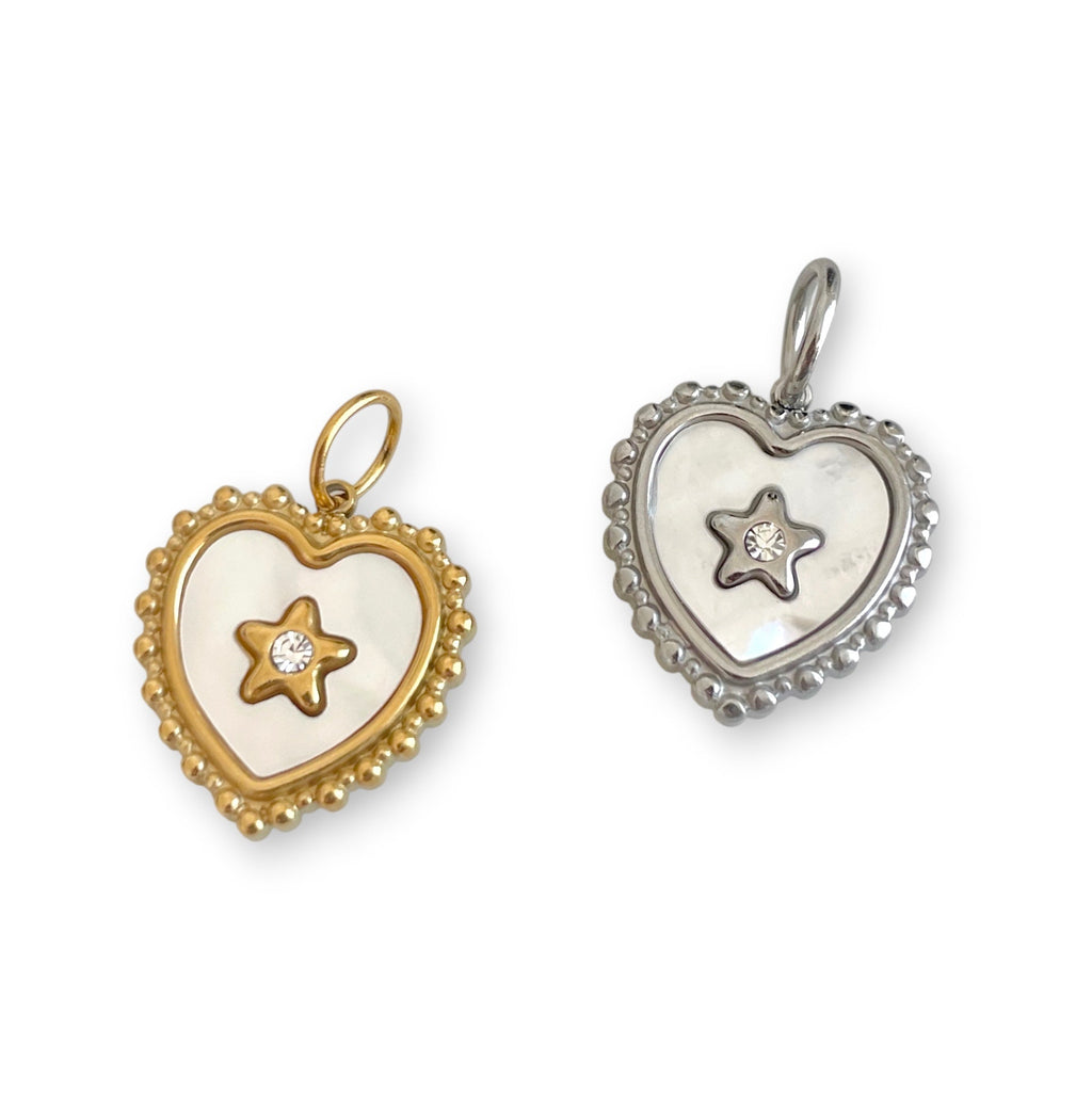 Two heart-shaped pendants, one gold and one silver, on a white background.