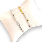 gold beaded bracelet and silver beaded bracelet