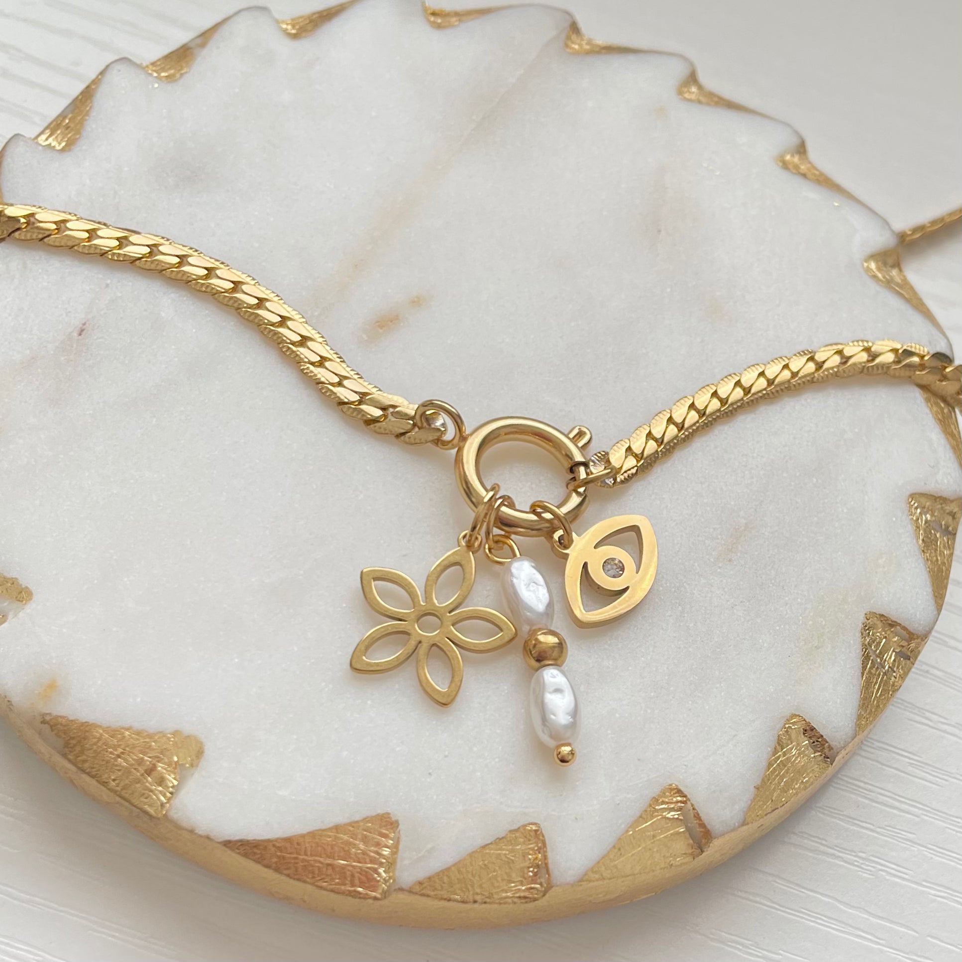 gold charm necklace with flower charm