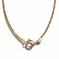 Gold chain necklace with a clasp on a white background