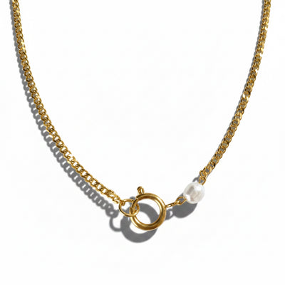Gold chain necklace with a clasp on a white background