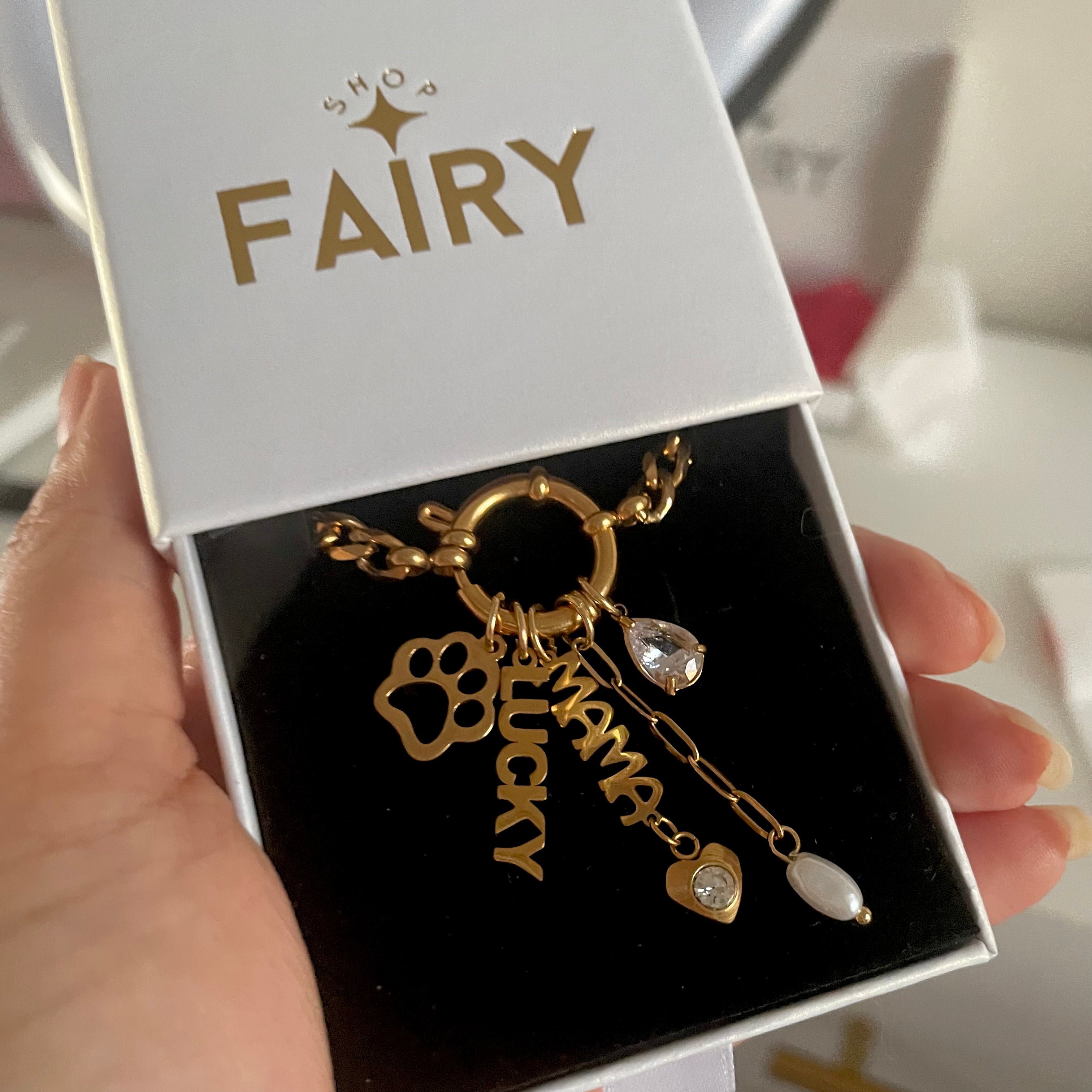 Gold charms on a gold charm necklace