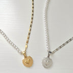 half pearl necklace with heart charm