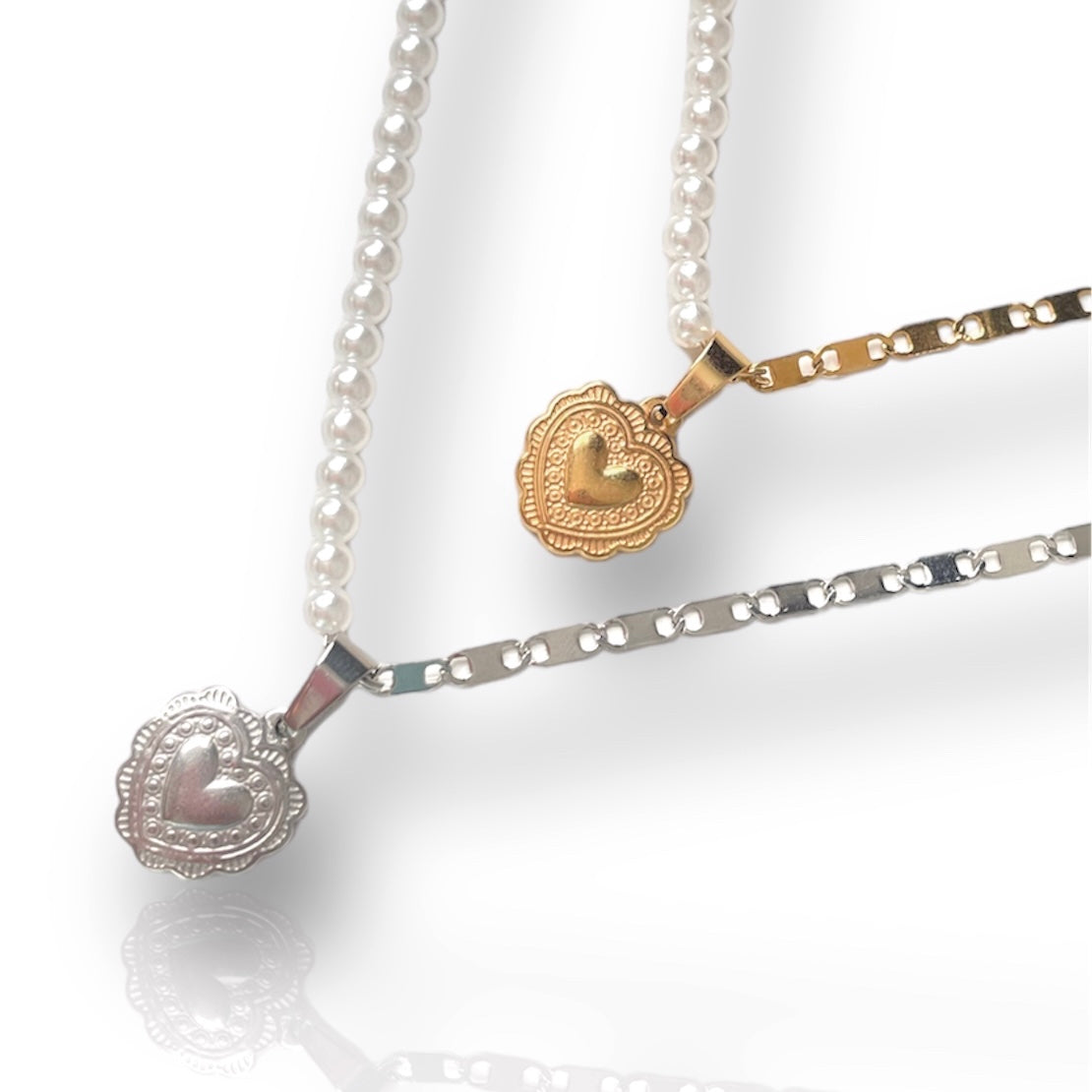 half pearl necklace with heart charms