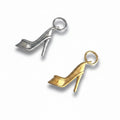 Two high heel shoe charms, one in gold color and one in silver color, designed to be attached to jewelry such as necklaces or bracelets.
