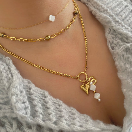 initial charm necklace with a clover pearl necklace