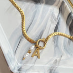 initial charm necklace with pearl drop charm