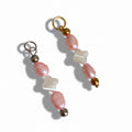 Two pink pearl charms with a clover shape in the center, accompanied by gold and silver steel beads at the top and bottom.