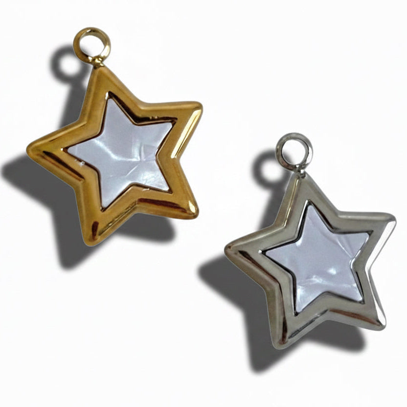 Two star-shaped pendants, one gold and one silver, on a white background