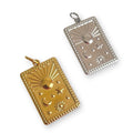 Two rectangular pendants with star, moon, and sun designs on a white background.