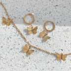 Gold butterfly necklace and matching silver butterfly earrings