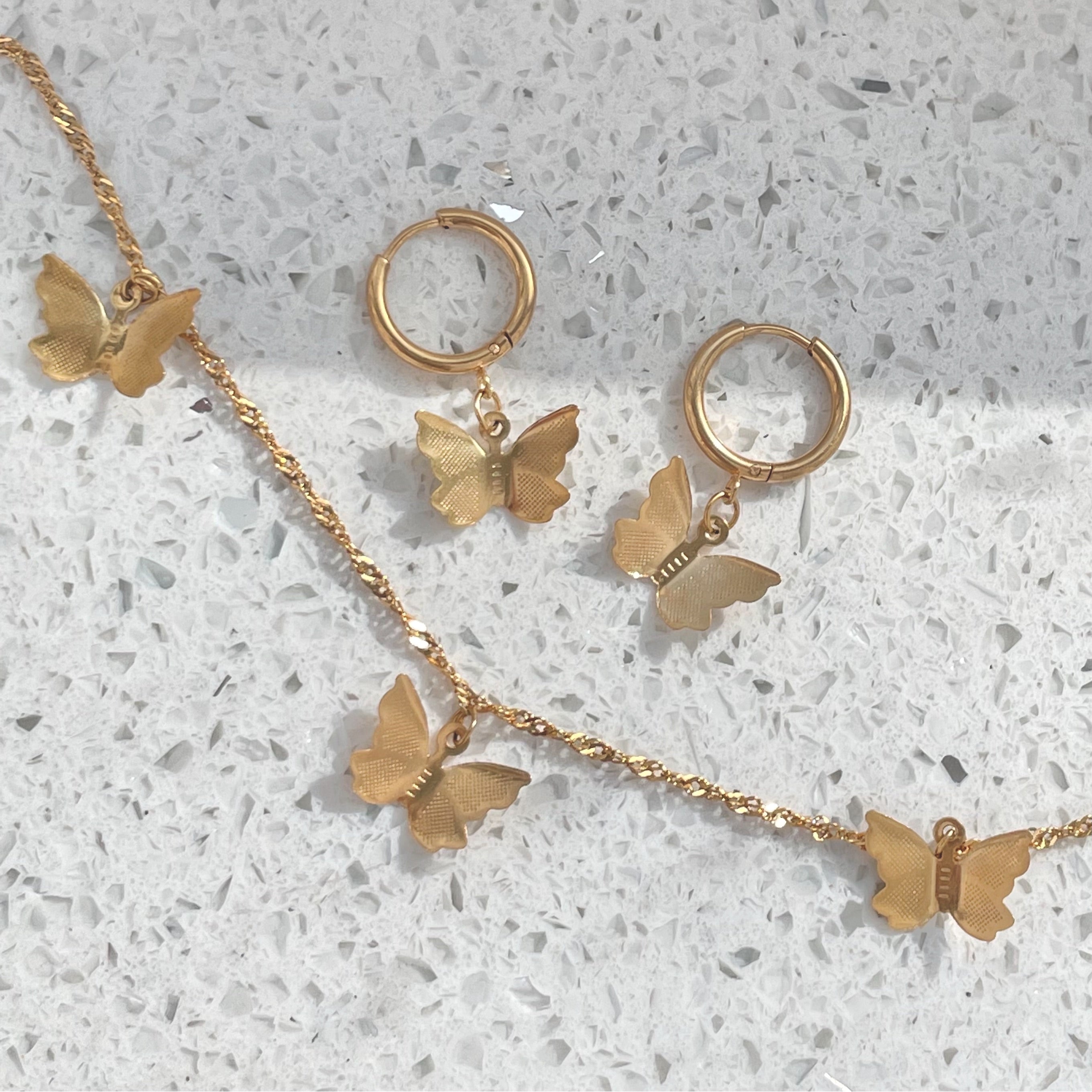 Gold butterfly necklace and matching silver butterfly earrings