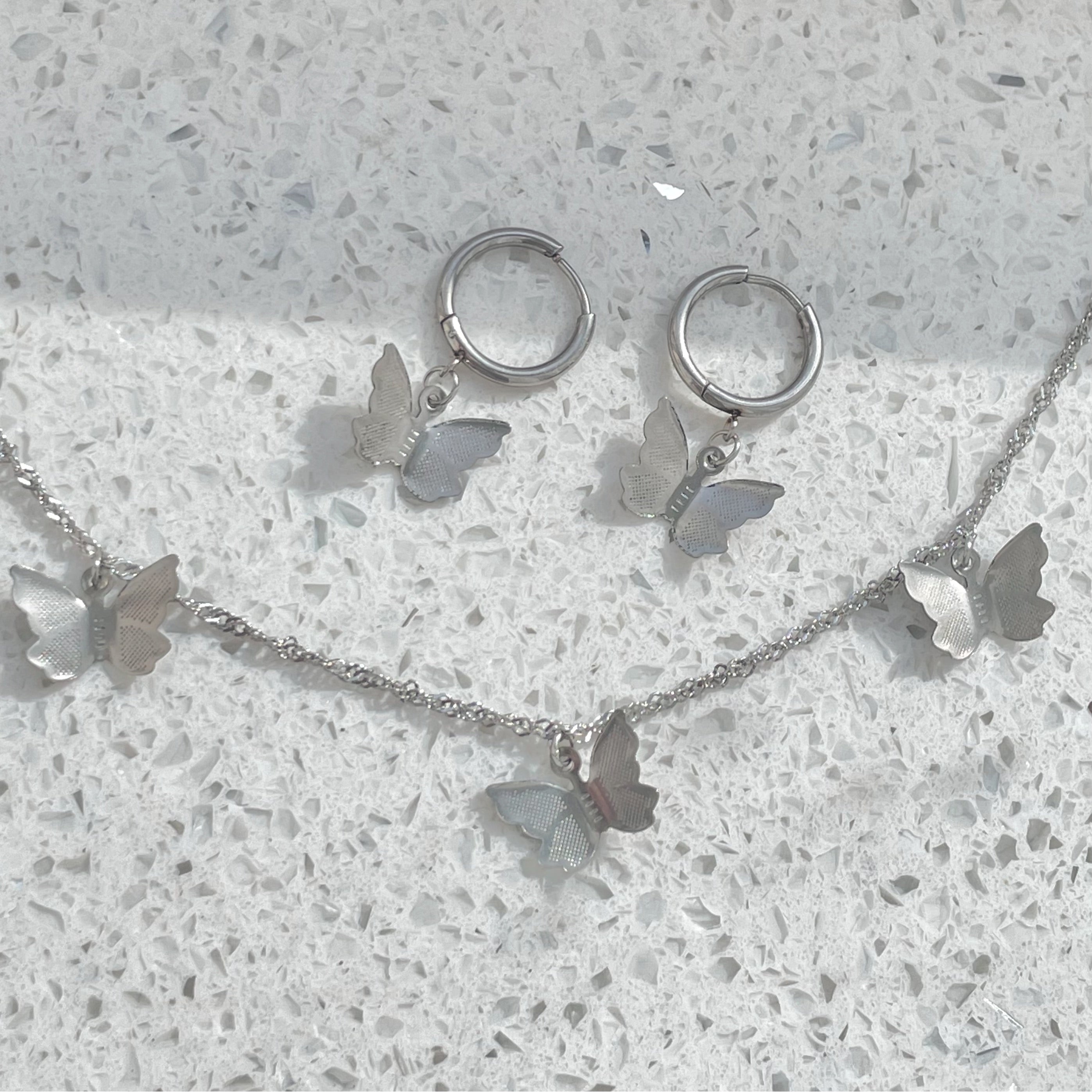 Silver butterfly necklace and matching silver butterfly earrings