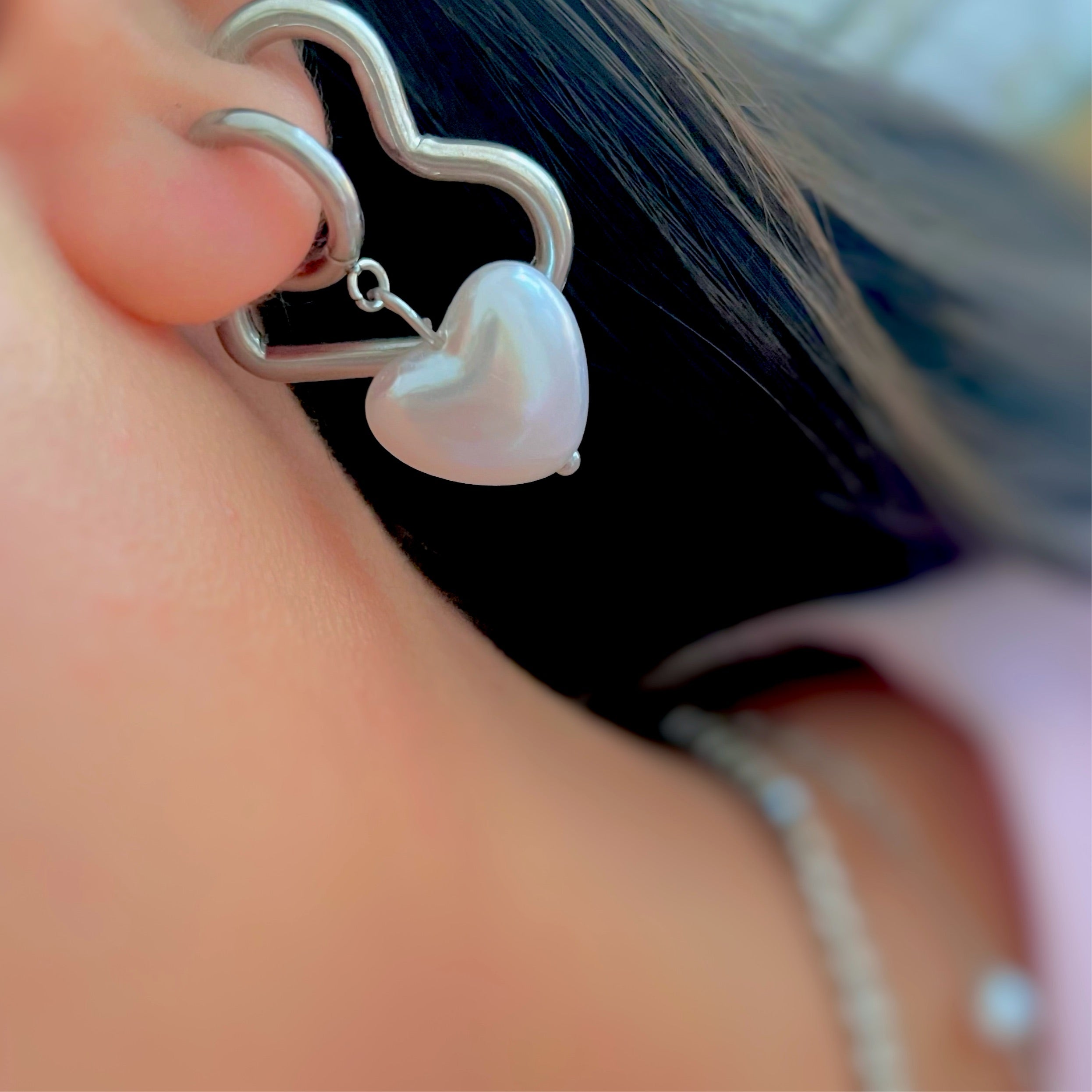Silver heart shaped hoops earrings