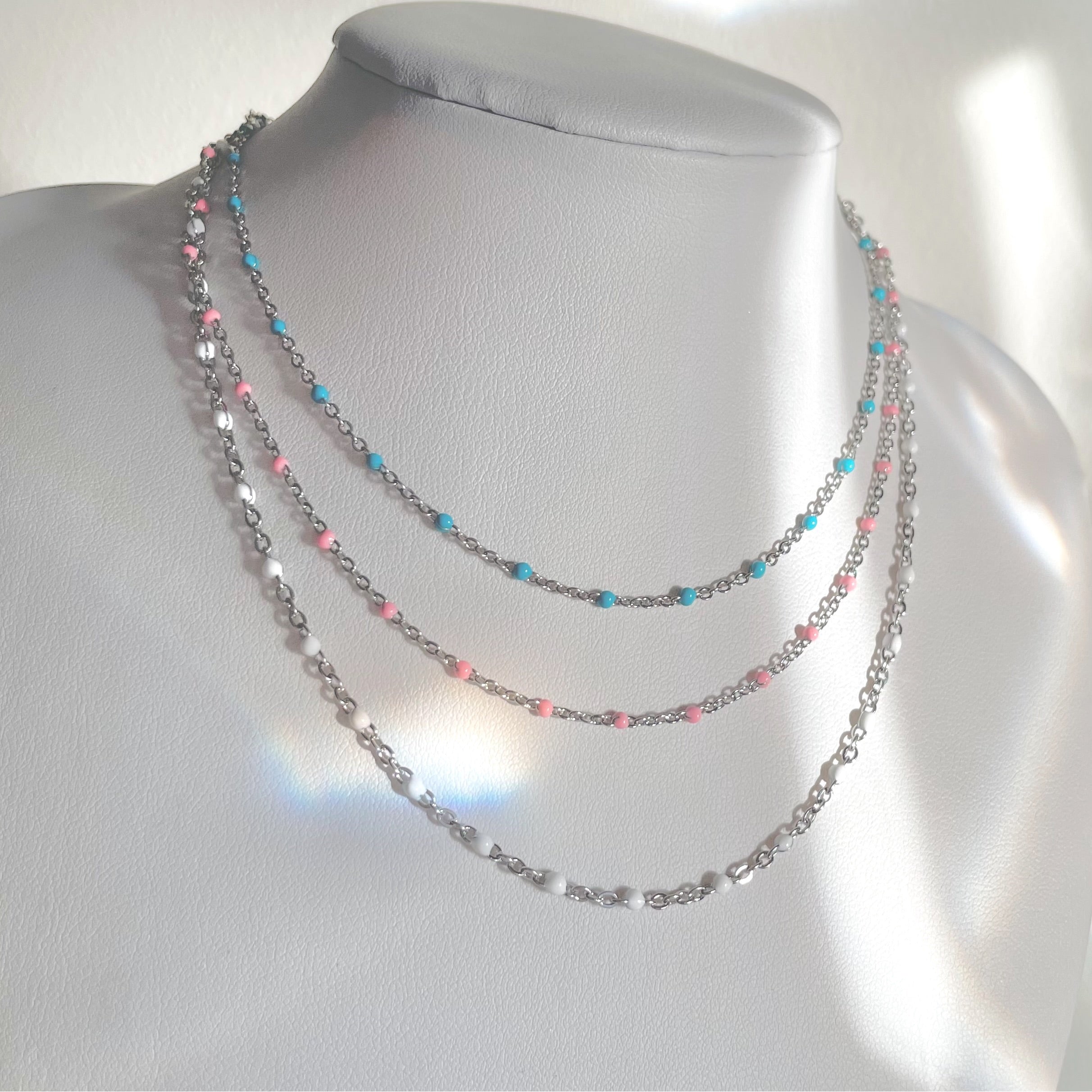 dainty silver necklaces with blue pink white enamel