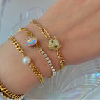 gold pearl bracelet leopard bracelet and half tennis necklace