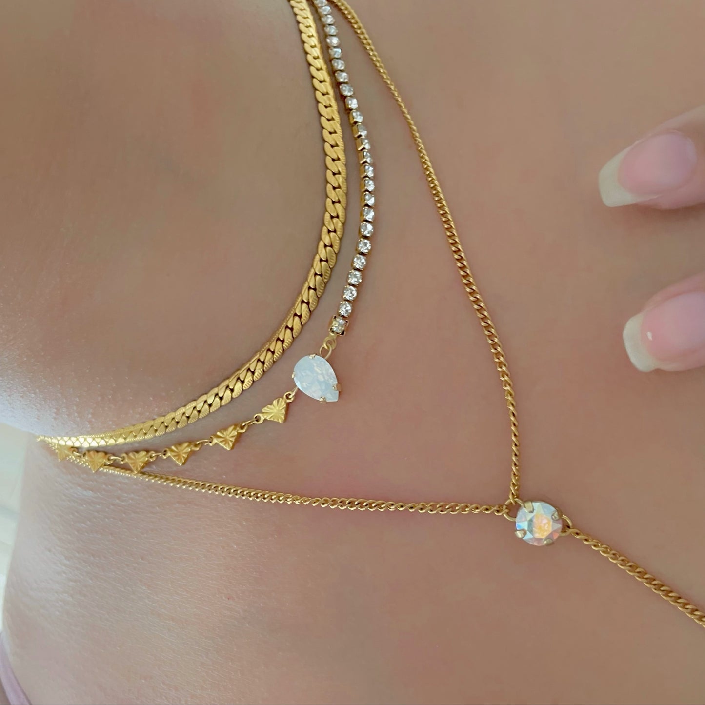 half tennis necklace and half heart necklace with crystal in the centre