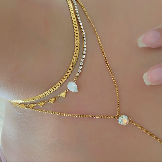 half tennis necklace and half heart necklace with crystal in the centre