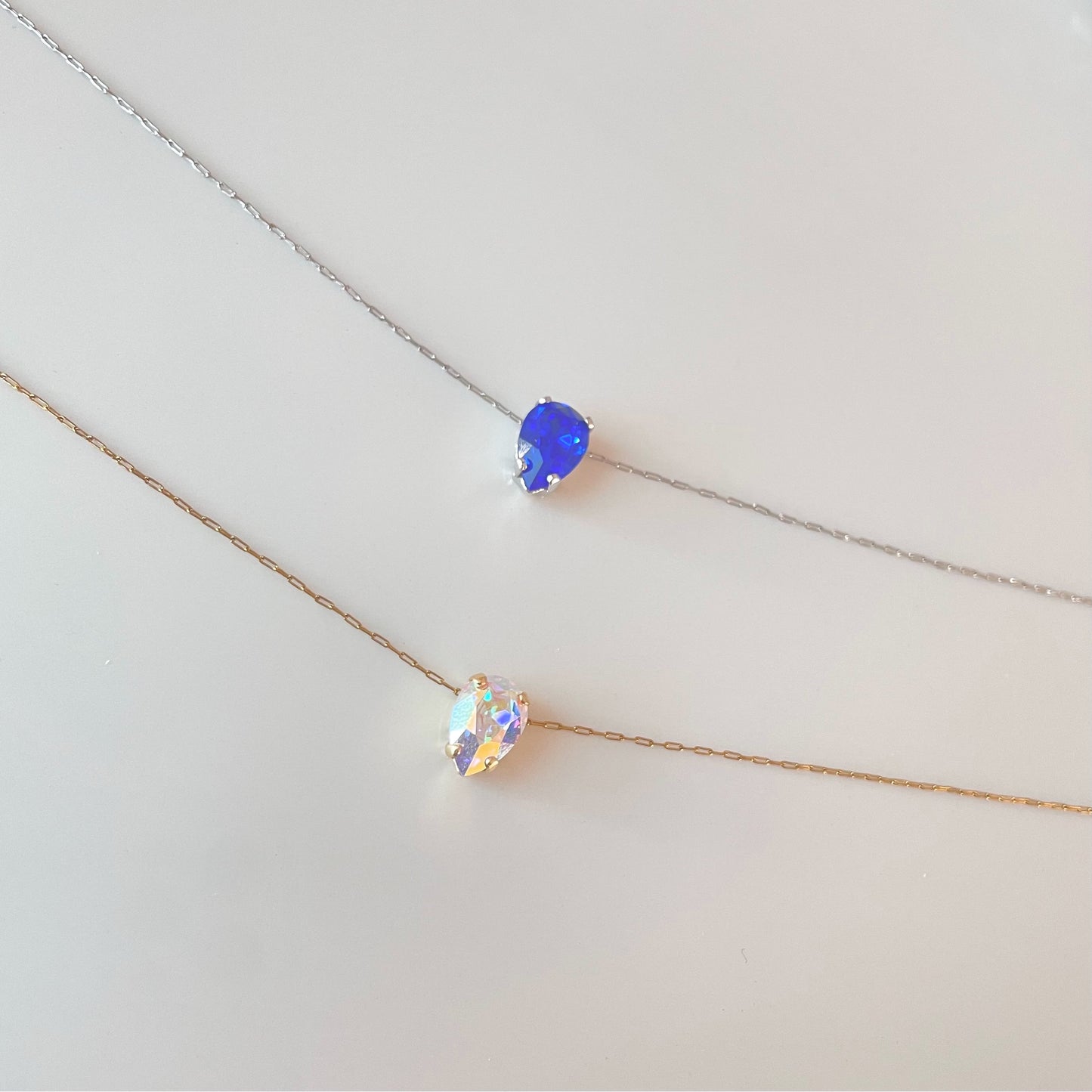 silver floating diamond necklace and gold floating diamond necklace